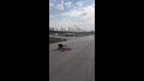 Daredevil biker defies gravity as three cars topple wooden structure in Rost... Stock Footage 249887187