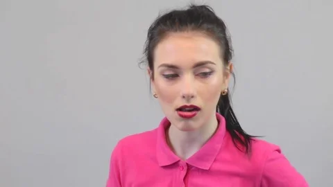 Daring beautiful girl posing at the camera Stock Footage 73433469