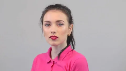 Daring young woman looking at camera Stock Footage 73434228