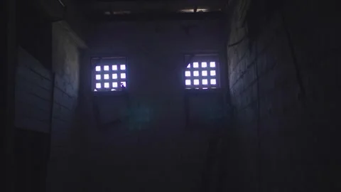 Dark Abandoned Prison Cell Interior With Two Barred Windows 4K Vídeo Stock 325767014