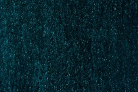 Dark abstract background for the design. Empty turquoise uniform surface. Stockfoto's