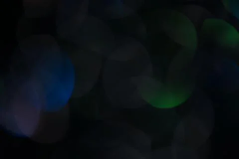 Dark abstract background from layered bokeh on a dark background. 写真素材
