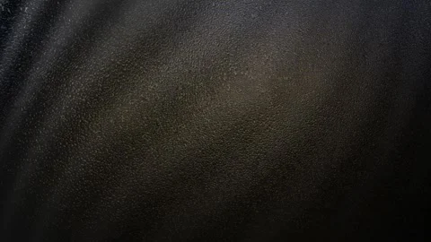 Dark abstract background with shimmering golden particles and subtle light strea Stock Footage 330290815