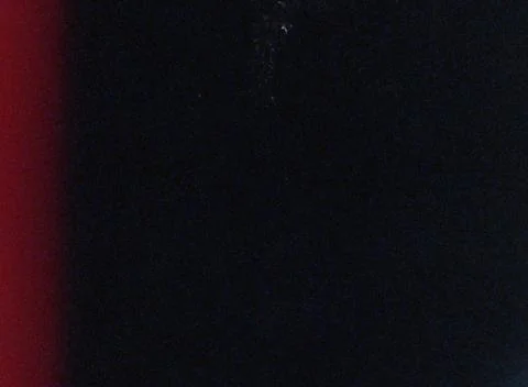 Dark abstract background with soft red gradient and grain Stock Photos