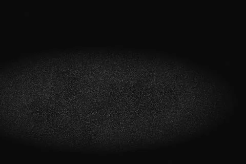 Dark abstract background with subtle speckles and soft spotlight effect Foto stock