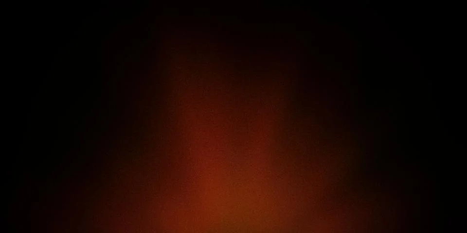 A dark, abstract gradient background with deep shades of orange and black. .. Illustrazione stock