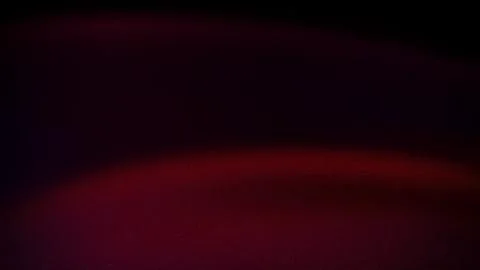 Dark abstract gradient with deep red and purple hues, featuring a soft, gra.. Stock Photos