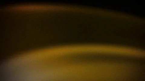 Dark abstract gradient with warm tones of amber and gold, accented by a sof.. Stock Photos