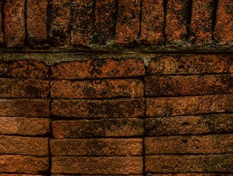 Dark Aged Red Brick Wall Corner Texture Background with Moss and Weathering Stock Photos