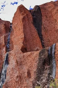 Dark algae-marked watermarks in Uluru-Kantju Gorge seen from base walk. NT-AUS Stock Photos
