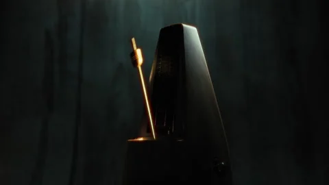 Dark Ambience With Light Over The Golden Metronome Stock Footage 301906361