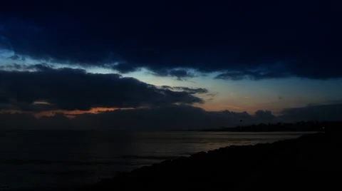 Dark and cloudy sky over calm sea. Stock Footage
