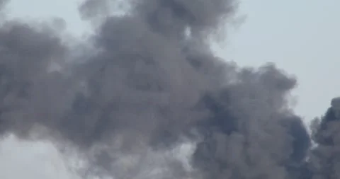 Dark and dense smoke from a fire Stock Footage 277933460
