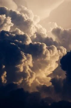 Dark and dramatic cumulus clouds forming into thunderstorm Stock Photos