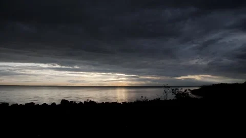 Dark and dramatic storm cloud sunset over the sea. Stock Footage 169405286