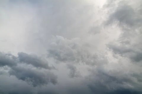 Dark and gray clouds formations in the sky. Only sky image, no land. Stock Photos