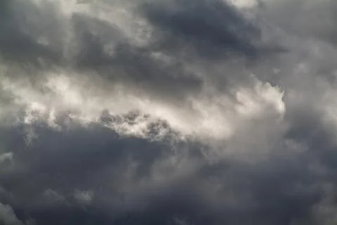 Dark and gray clouds formations in the sky. Only sky image, no land. Stock Photos