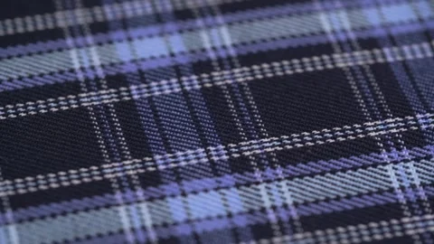 Dark and light blue checkered classic tartan. rotation of the fabric. closeup. Stock-Footage 243239830