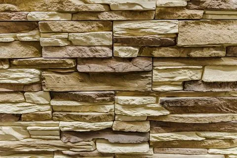 Dark and light brown bricks in wall texture Stock Photos