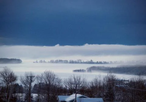 Dark and Light clouds over snow Stock Photos