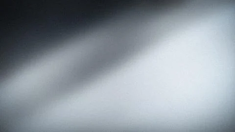 Dark and light gray abstract grainy background in 4K perfect for tech blur .. Stock Photos
