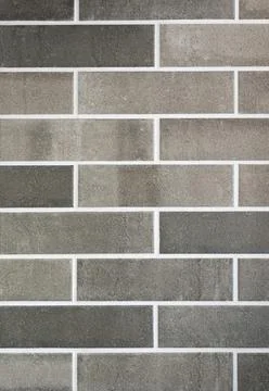 Dark and light grey bricks wall background Stock Photos