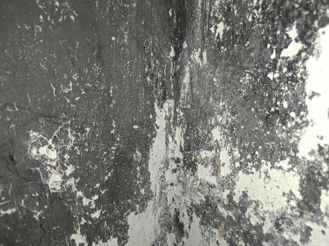 Dark and light surface with peeling paint suitable for backgrounds or textures i Stock Photos