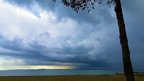 Dark and ominous storm clouds are gathering over the sea in skies above Sarkoy Stock Footage 323209624