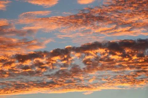 Dark and orange clouds in the evening  sky Stock Photos