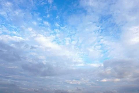 Dark and white clouds on blue sky Stock Photos