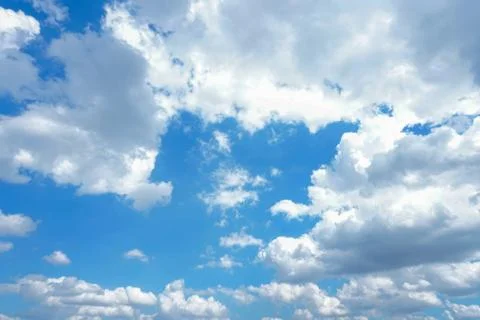Dark and white clouds on blue sky Stock Photos