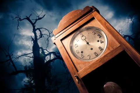 Dark antique clock at night Stock Photos