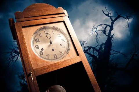 Dark antique clock at night Stock Photos