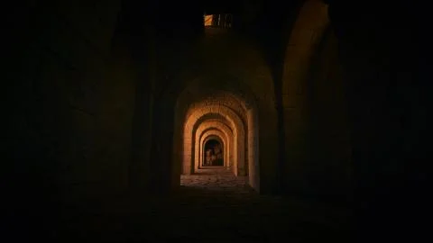 Dark arched corridor in the castle Stock Photos