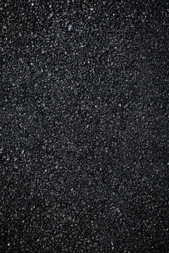 Dark asphalt roadbed. Stock Photos