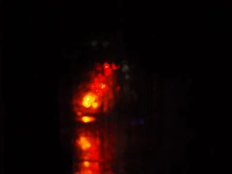 Dark background with blurry red lights Stock Photos