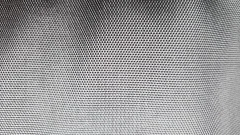 Dark background with a checkered texture. Stock Photos