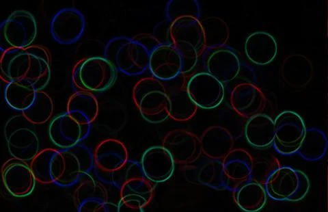 Dark background with circles of the rainbow. Funny seamless bakground with.. Stock Photos