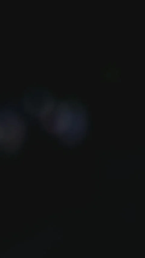 Dark background with colorful floating particles Stock Footage 333283595