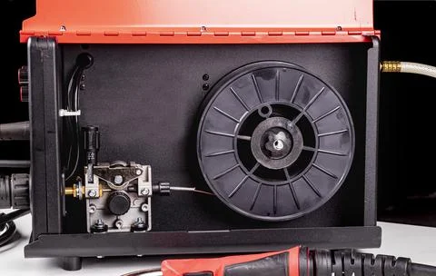 Dark background. the device is equipped with a unit for welding metal product Stock Photos