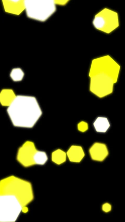 A dark background featuring glowing gold hexagonal light leaks and bokeh Vídeos de archivo 336369182