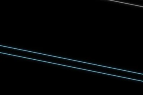Dark background with glowing blue light lines crossing Stock Photos