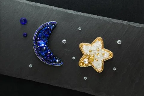 Dark background with handmade brooches Stock Photos