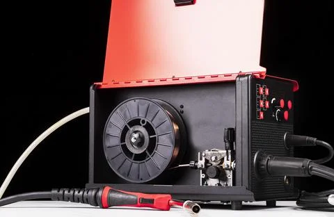 Dark background. it has an assembly for welding metal products. red color. cl Stock Photos