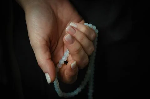 On a dark background light nails after manicure Stock Photos