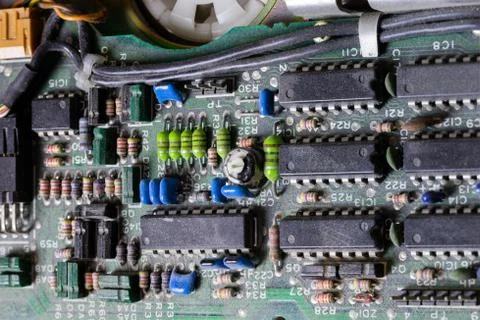 Dark background of old electronic circuit board closeup with dus Foto stock