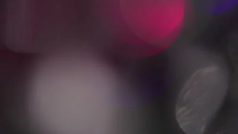 Dark background of overlapping colorful and sparkling white bokeh lights Видео 318730144
