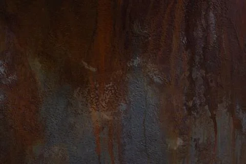 Dark background of oxidized copper with rust spots. Texture, wallpaper, pattern. Stock Photos