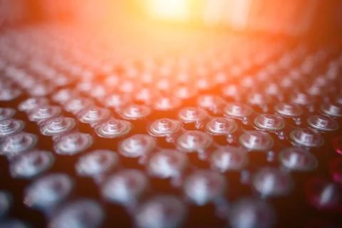 Dark background of rows of new batteries Foto stock