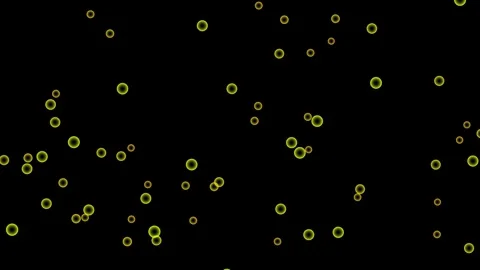 A dark background with scattered glowing golden circles resembling stars in.. Stock Footage 324976997